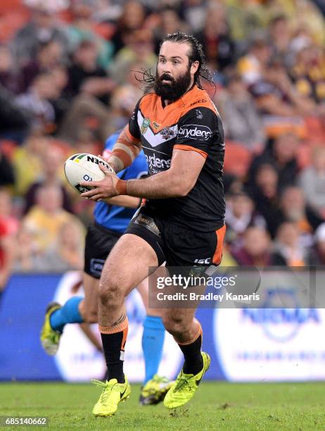 Aaron Woods of the Tigers runs with the ball during the round 11 NRL match between the Brisbane Broncos and the Wests Tigers at Suncorp Stadium on...