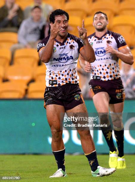 Tautau Moga of the Broncos celebrates scoring a try during the round 11 NRL match between the Brisbane Broncos and the Wests Tigers at Suncorp...