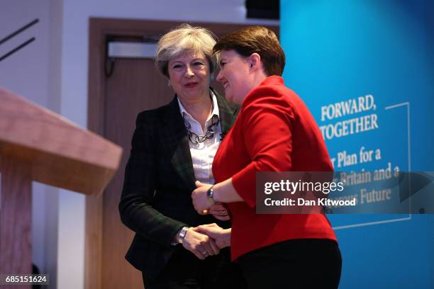 Scottish Conservative leader Ruth Davidson speaks to Britains's Prime Minister Theresa May as they launch the Scottish manifesto on May 19, 2017 in...