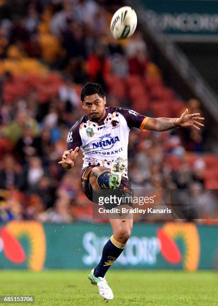 Anthony Milford of the Broncos kicks the ball during the round 11 NRL match between the Brisbane Broncos and the Wests Tigers at Suncorp Stadium on...