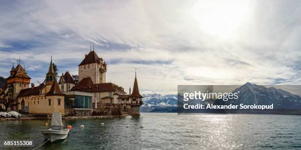beautiful medieval castle oberhofen on thun lake, alps, switzerland - oberhoffen castle stock pictures, royalty-free photos & images