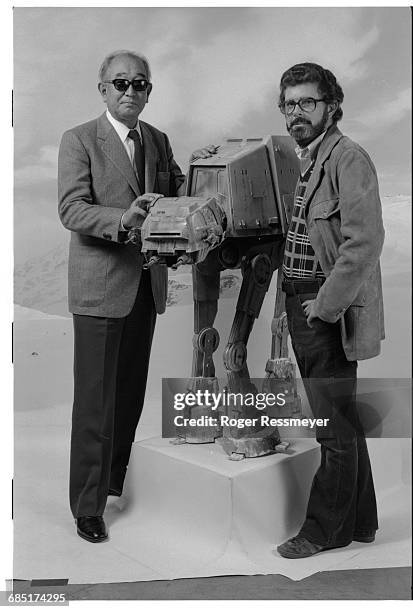 Kurosawa and Lucas pose with a model of the "Walker," on a set used for the 1980 film The Empire Strikes Back.