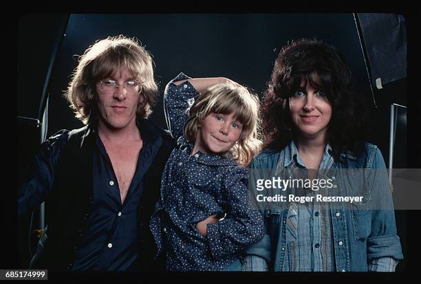 Paul Kantner and Grace Slick of the band Jefferson Starship with their daughter China during the recording of their Earth album.