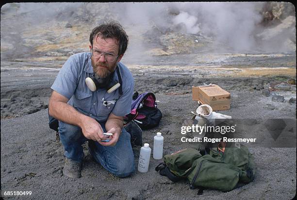 Geological Survey volcanologist Chris Newhall takes soil, water, and gas samples inside Mount Pinatubo's caldera. | Location: Mount Pinatubo,...