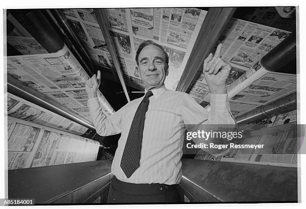 Publishing magnate Rupert Murdoch at the printing presses of the New York Post. | Location: Manahttan, New York, New York, USA.