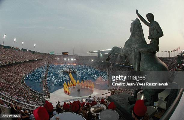 Opening ceremony of the Summer Olympic Games in Barcelona. Statue overlooking audience. | Location: Barcelona, Spain.