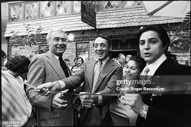 San Francisco mayor George Moscone and city supervisor Harvey Milk cut a ribbon in a restaurant-opening ceremony. Both men were assassinated four...