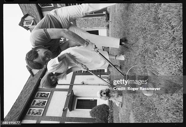 Lore Harp, the President of Vector Graphic Inc., plays croquet with her husband, Pat McGovern, at their home on the San Francisco peninsula. |...