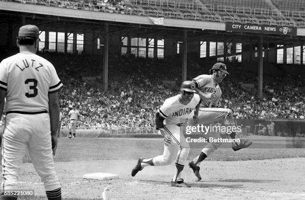 Roger Nelson, Kansas City pitcher, is bumped after beating Chris Chambliss, of Cleveland, to the bag for the out in 6th inning action. Chambliss hit...