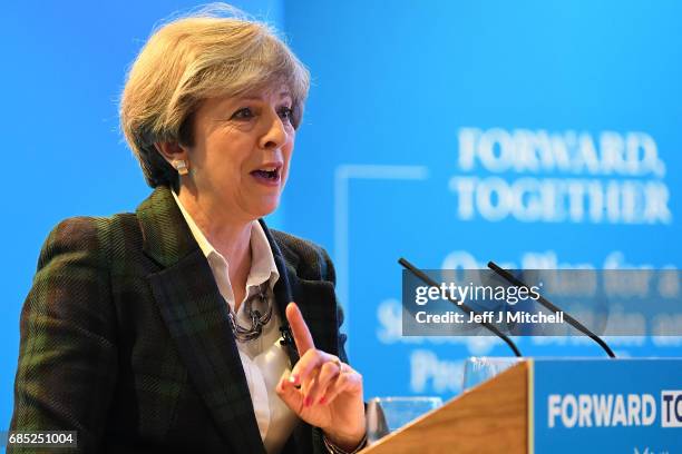 Britains's Prime Minister Theresa May gestures as she gives a speech at the launch of the Scottish manifesto on May 19, 2017 in Edinburgh, Scotland....