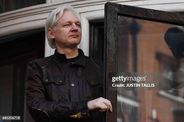 Wikileaks founder Julian Assange speaks on the balcony of the Embassy of Ecuador in London on May 19, 2017. Ecuador urged Britain today to "grant...