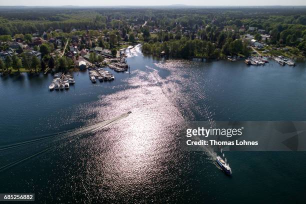An excursion boat drives across the lake 'Werlesee' in Brandenburg state on May 19, 2017 in Fangschleuse near Erkner, Germany. Brandenburg, with its...