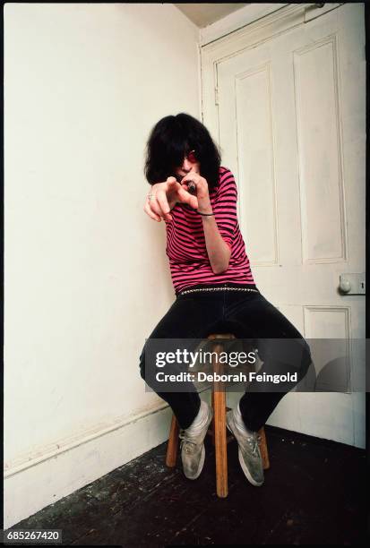 Deborah Feingold/Corbis via Getty Images) NEW YORK Lead singer for the The Ramones, musician, Joey Ramone poses for a portrait in 1983 in New York...