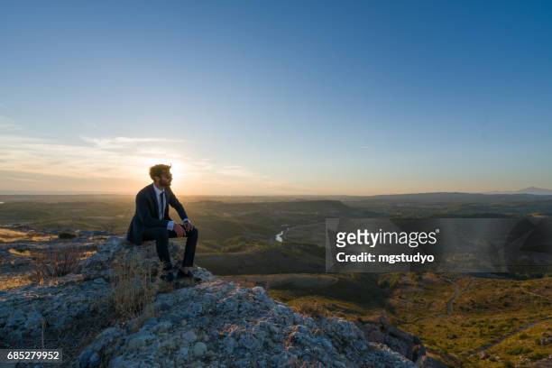 businessman freedom on the top of a high mountain - businessman meditating stock pictures, royalty-free photos & images