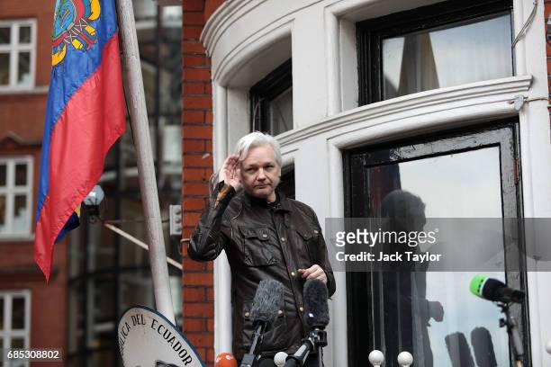 Julian Assange gestures as he speaks to the media from the balcony of the Embassy Of Ecuador on May 19, 2017 in London, England. Julian Assange,...