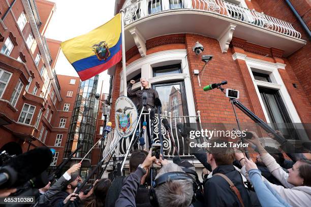 Julian Assange gestures as he speaks to the media from the balcony of the Embassy Of Ecuador on May 19, 2017 in London, England. Julian Assange,...