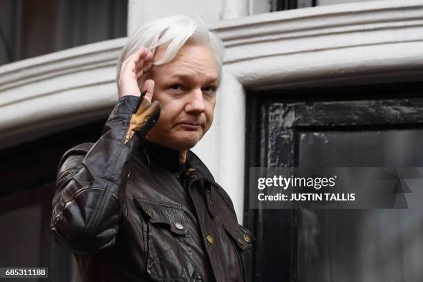 Wikileaks founder Julian Assange speaks on the balcony of the Embassy of Ecuador in London on May 19, 2017. - WikiLeaks founder Julian Assange on...