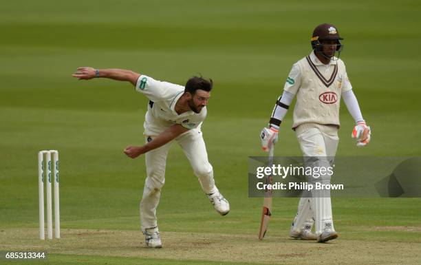 James Franklin of Middlesex bowls past Kumar Sangakkara of Surrey during day one of the Specsavers County Championship Division One cricket match...