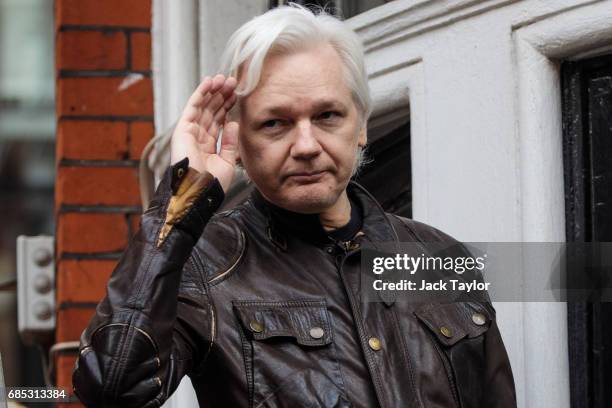 Julian Assange gestures as he speaks to the media from the balcony of the Embassy Of Ecuador on May 19, 2017 in London, England. Julian Assange,...