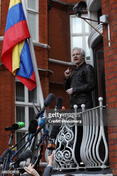 Julian Assange, founder of WikiLeaks, speaks to media and supporters from a balcony at the Ecuadorian embassy in London, U.K., on on Friday, May 19,...
