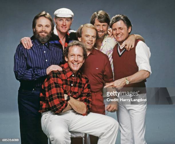 Photographer Harry Langdon poses for a portrait with the Beach Boys Carl Wilson, Mike Love, Al Jardine, Brian Wilson and Bruce Johnston in 1987 in...
