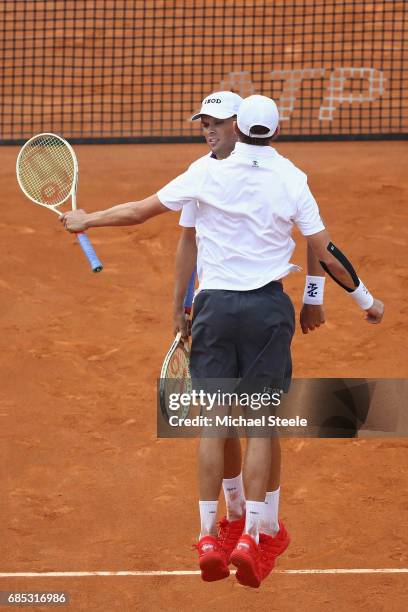 Bob Bryan and Mike Bryan of USA celebrate match point in the men's quarter-final match against Raven Klaasen of South Africa and Rajeev Ram of USA on...