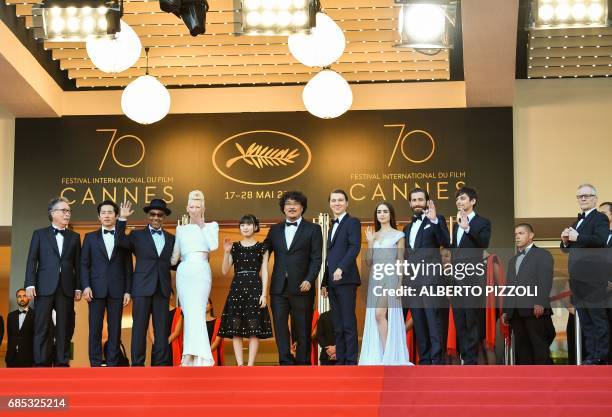 General Delegate of the Cannes Film Festival Thierry Fremaux greets Canadian actor Devon Bostick, US actor Jake Gyllenhaal, British actress Lily...