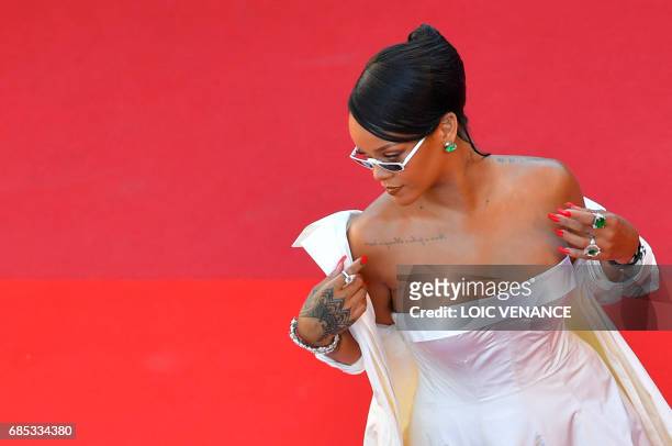 Barbadian singer Rihanna poses as she arrives on May 19, 2017 for the screening of the film 'Okja' at the 70th edition of the Cannes Film Festival in...