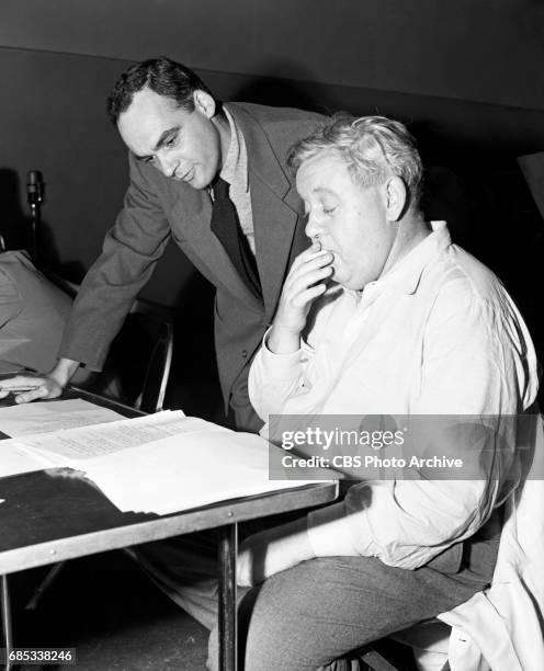 Script writer Antony Ellis talks with Actor Charles Laughton, who portrays Dr. Thomas Neill Cream, in CBS Radios "Suspense" program, and the...