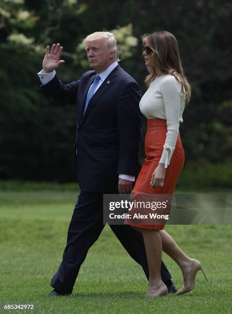 President Donald Trump and first lady Melania Trump walk on the South Lawn prior to their departure from the White House May 19, 2017 in Washington,...