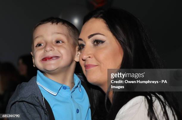 Terminally ill football mascot Bradley Lowery celebrates his sixth birthday with his mother Gemma at Blackhall Cricket Club near Durham.