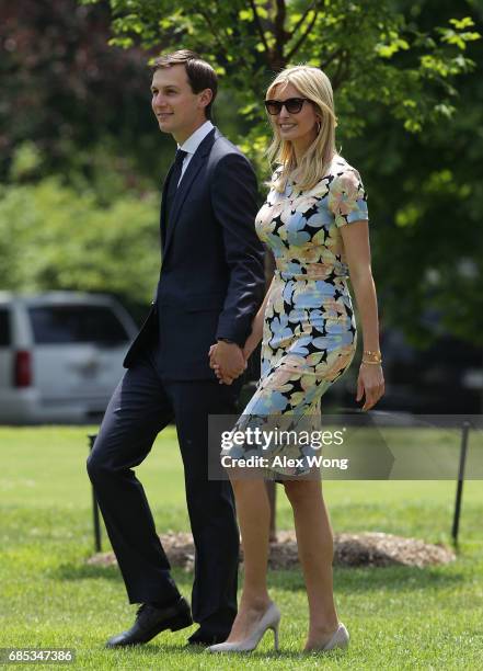 Ivanka Trump, daughter and assistant to U.S. President Donald Trump, walks with her husband, White House senior adviser Jared Kushner, on the South...