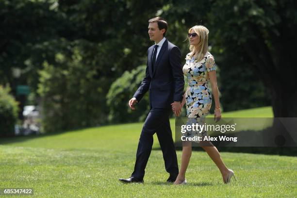 Ivanka Trump, daughter and assistant to U.S. President Donald Trump, walks with her husband, White House senior adviser Jared Kushner, on the South...