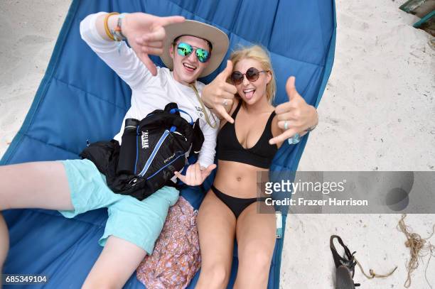 Festivalgoers flash the Shaka sign at 2017 Hangout Music Festival on May 19, 2017 in Gulf Shores, Alabama.