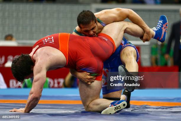 Gadzihiyev Nurmagomed of Azerbaijan and Mohammadi Amir of Iran compete in the Men's Freestyle Wrestling 97kg Gold Medal during day eight of Baku 2017...