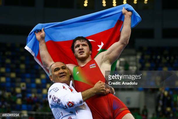 Gadzihiyev Nurmagomed of Azerbaijan celebrates his victory against Mohammadi Amir of Iran in the Mens Freestyle Wrestling 97kg Gold Medal during day...