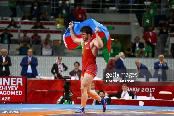 Gadzihiyev Nurmagomed of Azerbaijan celebrates his victory against Mohammadi Amir of Iran in the Mens Freestyle Wrestling 97kg Gold Medal during day...