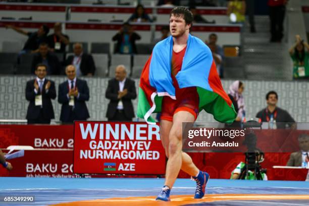 Gadzihiyev Nurmagomed of Azerbaijan celebrates his victory against Mohammadi Amir of Iran in the Mens Freestyle Wrestling 97kg Gold Medal during day...