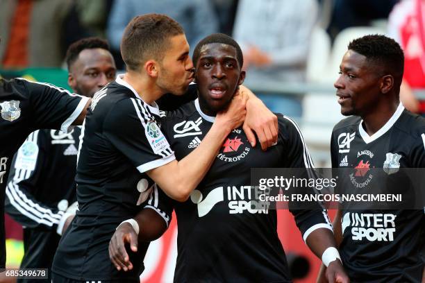 Amiens' forward Aboubakar Famara celebrates with teammates after scoring a goal during the French Ligue 2 Football match Reims versus Amiens on May...