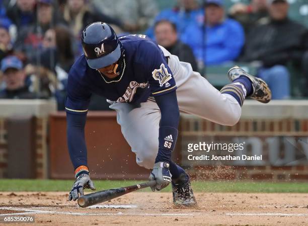 Keon Broxton of the Milwaukee Brewers is knocked down by a close pitch against the Chicago Cubs at Wrigley Field on May 19, 2017 in Chicago, Illinois.