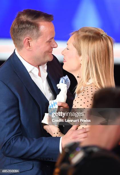 Nadja Uhl hands over the award to Devid Striesow, winner of the category 'Best Male Actor', during the Bayerischer Fernsehpreis 2017 show at...