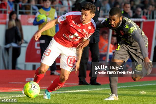 Brest's French defender Gaetan Belaud vies with Gazelec-Ajaccio's French midifelder Youssouf M'Changama during the French Ligue 2 football match...