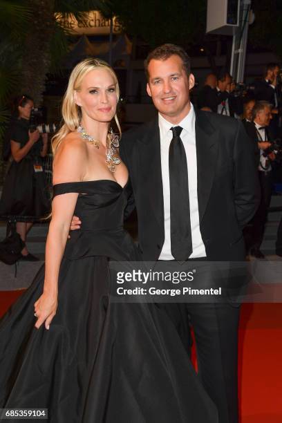 Molly Sims and Scott Stuber departs from the "Okja" screening during the 70th annual Cannes Film Festival at Palais des Festivals on May 19, 2017 in...