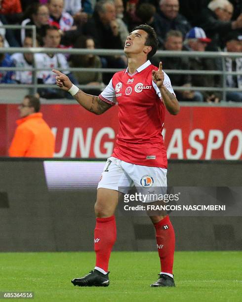 Reims' midfielder Diego Rigonato celebrates after scoring a goal during the French Ligue 2 Football match Reims versus Amiens on May 19, 2017 at the...