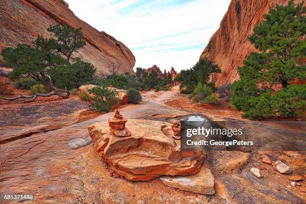 arches national park double o arch hiking trail - cairn stock pictures, royalty-free photos & images