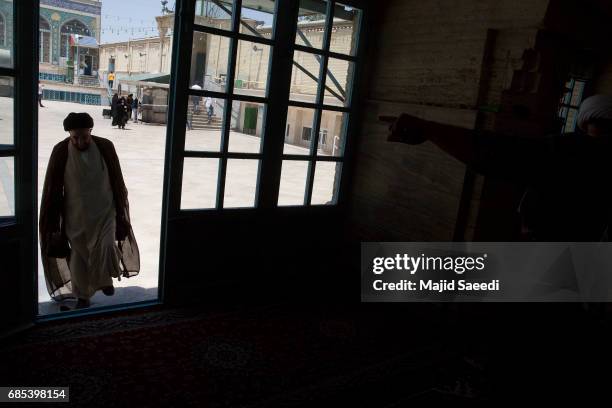 Iranians vote in the twelfth presidential election on May 19, 2017 in the city of Qom, south of the capital Tehran, Iran. Iranians began voting...