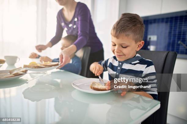 little boys having breakfast - buttering stock pictures, royalty-free photos & images