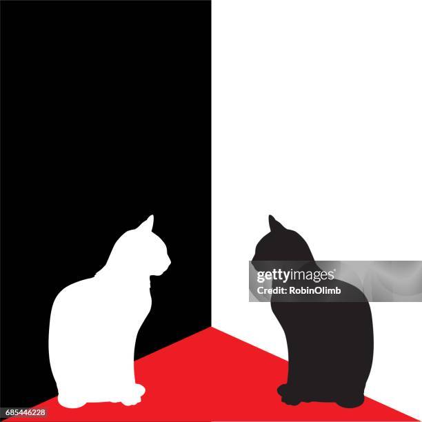 white and black cats in corner - two animals stock illustrations