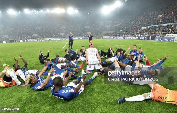 Strasbourg's players celebrate after the French L2 football match between Strasbourg and Bourg-en-Bresse at the Meinau stadium on May 19, 2017 in...