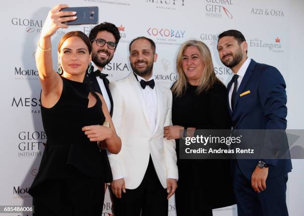 Designers Assaad Osta and George Azzi and guests attend the Eva Longoria Global Gift Gala during the 70th annual Cannes Film Festival at on May 19,...